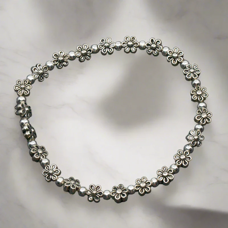 Elasticated Flower Bracelet In Silver Plate