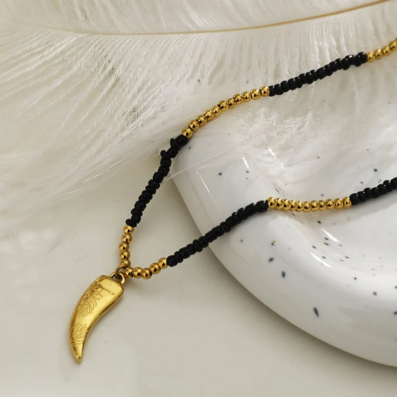 RITA Black & Gold Beaded Chain Necklace with Etched Gold Tooth Pendant