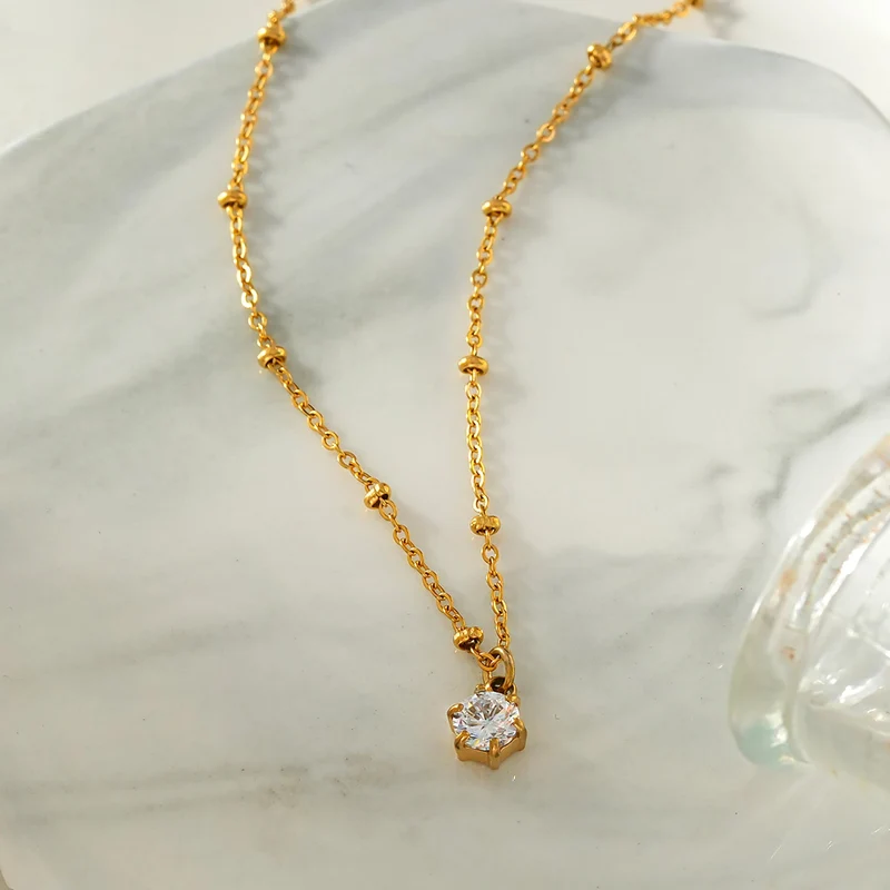 KADIRI Gold: Solitaire Zirconia Charm Pendant on a Beaded Chain Necklace